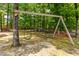Backyard swingset among mature trees at 2912 Turning Brook Ln, Raleigh, NC 27616