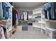 Spacious walk-in closet with custom shelving and ample storage space at 2912 Turning Brook Ln, Raleigh, NC 27616