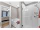 Bright bathroom features a tub and separate glass shower and is adjacent to the main bedroom at 303 Leighann Ridge Ln, Rolesville, NC 27571