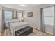 Comfortable bedroom with light-colored walls and hardwood floors and natural light is perfect for unwinding at 303 Leighann Ridge Ln, Rolesville, NC 27571