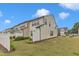 Exterior townhome view in a residential area with lush lawn and privacy fence at 303 Leighann Ridge Ln, Rolesville, NC 27571
