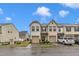 Charming townhome with two-car garage, landscaped front yard, and neutral exterior at 303 Leighann Ridge Ln, Rolesville, NC 27571