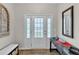 Bright entryway with glass front door and console table with decor at 303 Leighann Ridge Ln, Rolesville, NC 27571