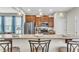 Kitchen with a granite breakfast bar, stainless steel refrigerator, and pendant lighting at 303 Leighann Ridge Ln, Rolesville, NC 27571