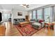 Spacious living room with hardwood floors, natural light, and comfortable sectional sofa at 303 Leighann Ridge Ln, Rolesville, NC 27571