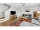 Cozy living room featuring hardwood floors, stairs, and comfortable seating at 303 Leighann Ridge Ln, Rolesville, NC 27571