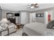 Comfortable main bedroom features sitting area, large dresser, and natural light perfect for relaxing after a long day at 303 Leighann Ridge Ln, Rolesville, NC 27571