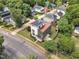 Aerial view of a modern home with a rooftop deck and solar panels in a suburban neighborhood at 304 S Tarboro St, Raleigh, NC 27610