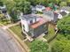 Aerial view of modern home featuring a rooftop patio, solar panels, and a carport at 304 S Tarboro St, Raleigh, NC 27610
