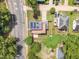 Aerial view of a home featuring solar panels and fenced yard in a suburban neighborhood at 304 S Tarboro St, Raleigh, NC 27610