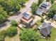 An aerial perspective displays a modern house, complete with solar panels and a fully fenced backyard at 304 S Tarboro St, Raleigh, NC 27610