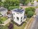 Modern home with rooftop deck, solar panels, carport, and manicured landscaping in a suburban neighborhood at 304 S Tarboro St, Raleigh, NC 27610