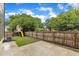Fully fenced backyard with patio, grassy area, and playset, offering privacy and recreation at 304 S Tarboro St, Raleigh, NC 27610