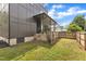 Modern home featuring a fenced backyard, a covered patio and an access gate at 304 S Tarboro St, Raleigh, NC 27610