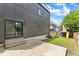 Modern home with concrete patio, fenced yard, and sliding glass doors for indoor/outdoor living at 304 S Tarboro St, Raleigh, NC 27610