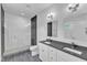 Sleek bathroom features an expansive shower, a dual sink vanity, and modern fixtures at 304 S Tarboro St, Raleigh, NC 27610
