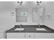 Bathroom featuring a dual sink vanity with sleek countertops and modern fixtures at 304 S Tarboro St, Raleigh, NC 27610