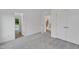 Neutral bedroom featuring soft carpet and multiple doorways creating an open feel at 304 S Tarboro St, Raleigh, NC 27610