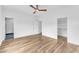 Bedroom featuring hardwood floors, an en suite bathroom, and a walk-in closet at 304 S Tarboro St, Raleigh, NC 27610