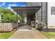 Attached carport featuring a covered parking area and small wooden deck with space for outdoor seating at 304 S Tarboro St, Raleigh, NC 27610
