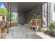 Attached carport with covered parking, small porch with wooden stairs, and storage access at 304 S Tarboro St, Raleigh, NC 27610