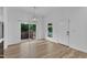 Bright dining area with sliding glass doors to the outdoor patio and modern light fixture at 304 S Tarboro St, Raleigh, NC 27610