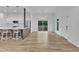 Modern dining area with hardwood floors, pendant lighting, and access to the outdoor patio at 304 S Tarboro St, Raleigh, NC 27610