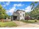 Modern two-story home featuring a rooftop deck, carport, contemporary siding, and landscaped front yard at 304 S Tarboro St, Raleigh, NC 27610