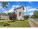 Contemporary home with a rooftop deck, modern windows, manicured lawn, and fresh landscaping at 304 S Tarboro St, Raleigh, NC 27610