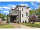 Contemporary two-story home with a unique rooftop patio, gray siding, and a convenient carport at 304 S Tarboro St, Raleigh, NC 27610