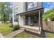 Modern two-story home with a covered front porch, landscaped yard, and contemporary siding at 304 S Tarboro St, Raleigh, NC 27610