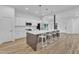 Beautiful kitchen with a large island with seating and modern, stainless steel appliances at 304 S Tarboro St, Raleigh, NC 27610