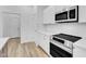 Modern kitchen with stainless appliances at 304 S Tarboro St, Raleigh, NC 27610