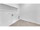 Simple laundry room with gray floors and connections for washer and dryer at 304 S Tarboro St, Raleigh, NC 27610