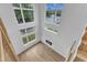 Bright living room with hardwood floors, a modern fireplace, soaring ceilings, and large windows offering plenty of natural light at 304 S Tarboro St, Raleigh, NC 27610