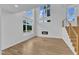 Bright living room with soaring ceilings, large windows, hardwood floors, and a modern fireplace at 304 S Tarboro St, Raleigh, NC 27610