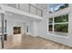 Bright open floor plan features soaring ceilings, hardwood floors, and modern light fixtures at 304 S Tarboro St, Raleigh, NC 27610