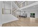 Bright open floor plan with hardwood floors, modern staircase, and a view of the kitchen at 304 S Tarboro St, Raleigh, NC 27610