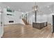 Spacious living room and kitchen boast an open layout, wood floors, and modern fireplace at 304 S Tarboro St, Raleigh, NC 27610