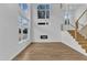 Spacious living room with soaring ceilings, large windows, hardwood floors, and a modern fireplace at 304 S Tarboro St, Raleigh, NC 27610