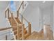 Bright staircase with wood steps and cable railing, with large windows at 304 S Tarboro St, Raleigh, NC 27610