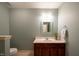 Neutral bathroom with a single sink vanity and updated fixtures at 306 Plank Bridge Way, Morrisville, NC 27560