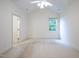 Spacious bedroom with neutral walls, vaulted ceilings, and ample natural light from the single window at 306 Plank Bridge Way, Morrisville, NC 27560