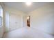 Cozy bedroom featuring a double closet and neutral walls and carpet at 306 Plank Bridge Way, Morrisville, NC 27560
