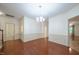 Dining room with chair rail, hardwood floors, and chandelier at 306 Plank Bridge Way, Morrisville, NC 27560