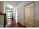 Inviting home foyer with hardwood floors, open doorway and natural light at 306 Plank Bridge Way, Morrisville, NC 27560
