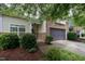 Inviting home exterior with stone accents and a well-manicured lawn at 306 Plank Bridge Way, Morrisville, NC 27560