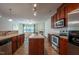 Open kitchen with stainless steel appliances, granite counters, and ample cabinetry at 306 Plank Bridge Way, Morrisville, NC 27560