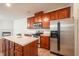 Well-equipped kitchen with an island, stainless appliances, and a breakfast bar at 306 Plank Bridge Way, Morrisville, NC 27560