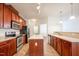 Spacious kitchen with an island, stainless appliances, and wooden cabinets at 306 Plank Bridge Way, Morrisville, NC 27560